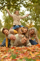 Fototapeta premium Family relaxing in autumn park
