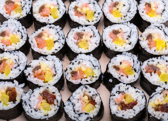  sushi fresh maki rolls isolated on wooden board