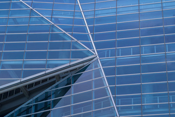 Fototapeta na wymiar Facade - shapes from a modern building, with structural lines reflection