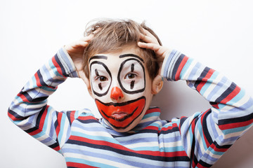 little cute boy with facepaint like clown, pantomimic expressions close up