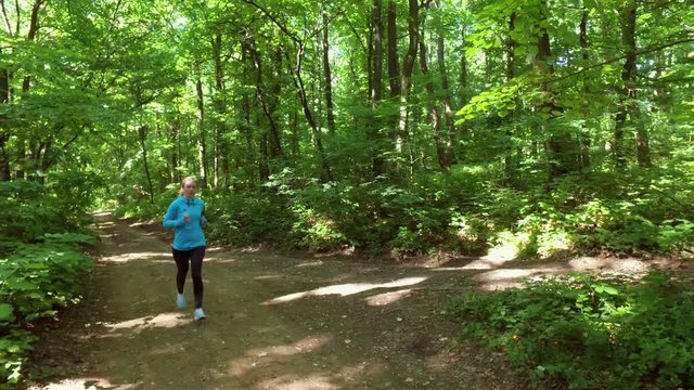 running jogging in forest. People training, running, jogging, fitness, runner-4k video
