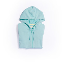 Mint color hoodie top view on white background
