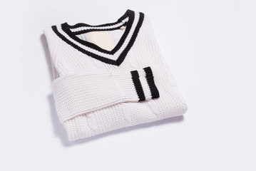 White knitted sweater on white background