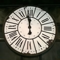Vintage Parisian clock - minutes to midnight. The clock has a vintage Parisian look.