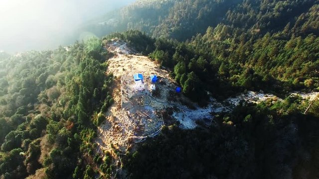 Poon hill peak lookout tower, Himalayas, Nepal. Aerial view mountain panoramic 4k video nature background.