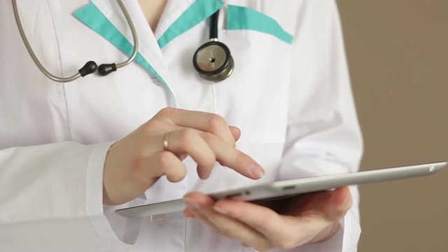 Doctor with Data Tablet