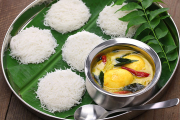 idiyappam (string hoppers)  with egg curry, south indian and sri lankan cuisine