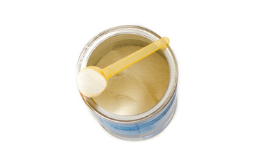 Powdered Milk, Baby Formula with spoon infant formula in can and bottle for feeding baby. dairy food for baby spilling out of a measuring scoop.