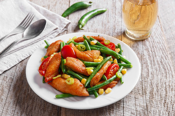 chicken meat with green beans and tomato corn
