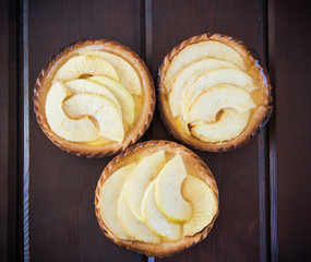 Cake with apples on a dark background