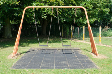 Empty swings in a playground