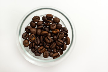 Glass cup with coffee beans