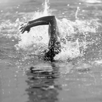 Freestyle swimmer, front view, black and white