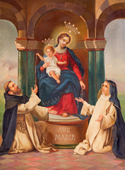 BRESCIA, ITALY - MAY 21, 2016: The painting of Madonna with the carmelitans St. John of the cross and St. Theresia of Avilla in church Chiesa di San Giuseppe by unknown artist of 19. cent.