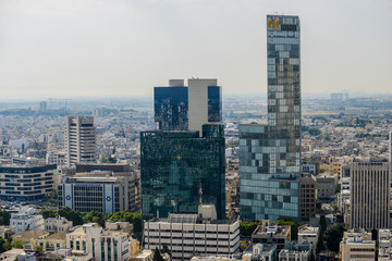 Fototapeta na wymiar Panoramic view on roofs of Tel-Aviv on the modern buildings bac