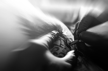 Tattoo painting. Close up. Black and white image.