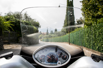 Scooter driving around the Lake Garda in Italy