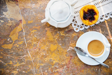Conceived with the morning coffee and cakes (Pasteis de nata, typical pastry from Portugal) on natural marble surface.