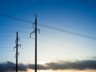 Power line on background of blue sky