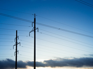 Power line on background of blue sky