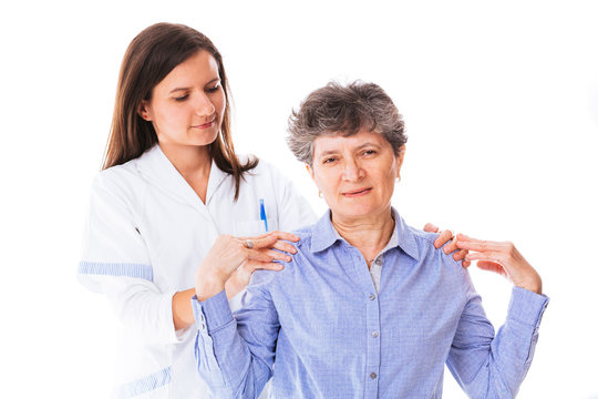 Doctor helping her patient to relieve the back pain