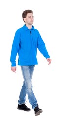 front view of going handsome man. walking young guy . Curly boy in the blue jacket proudly moving forward.