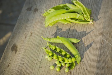 pea pods on wooden table