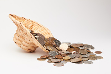 Wicker hat with coins./Wicker hat with coins.