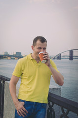 Fototapeta premium Attractive guy drinking coffee