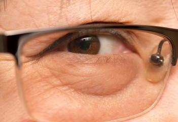 view from behind his glasses. close