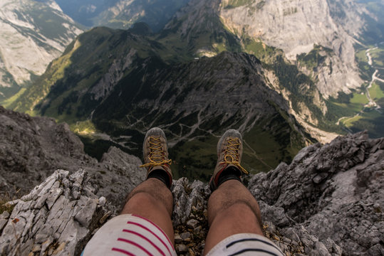 Dangling over the canyon of Ahornboden, on top of Lampsenspitze in Austria
