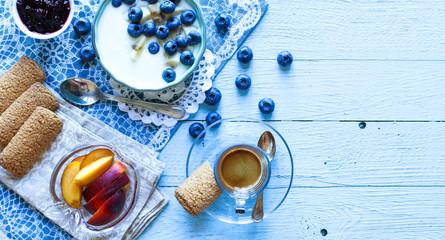 Fototapeta na wymiar Healthy Breakfast with blueberries and banana yogurt