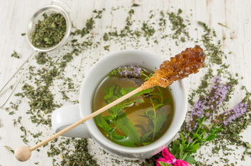 Mint tea with herbs in a teacup