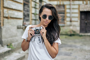 Beautiful young stylish woman in sunglasses