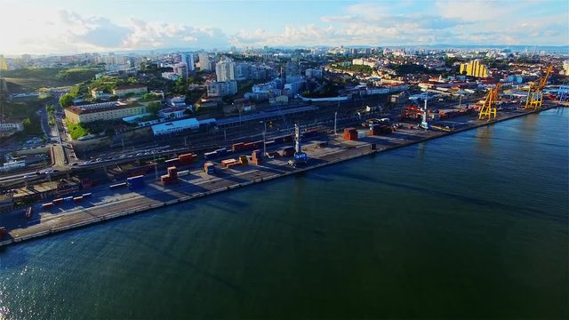 Aerial ocean view of Lisbon city coastline and port dock waterfront. Portugal 4k travel high speed video panoramic background.
