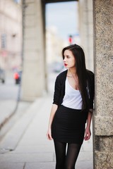 Portrait of glamorous young brunette girl with brightly painted