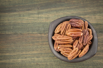 Pecan nuts on a wooden table