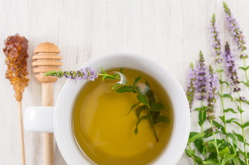 Mint tea with herbs in a teacup