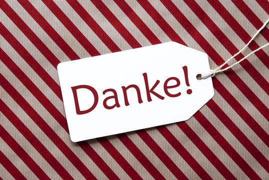 Label On Red Wrapping Paper, Danke Means Thank You