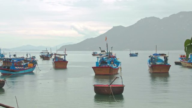 Fishing Boats in Sea Bay against Hill in Vietnam