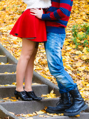 Romantic pair meet in park standing on stairs.