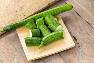 Snake gourd on wooden background