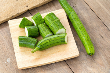 Snake gourd on wooden background