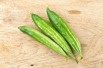 Snake gourd on wooden background