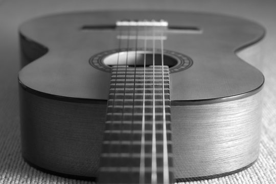 acoustic, classical guitar on floor. bw filter
