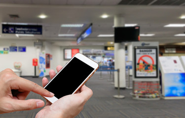 Human holding blank screen of smart phone and waiting departures