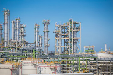 Fototapeta na wymiar Petroleum and refinery industrial plant with blue sky