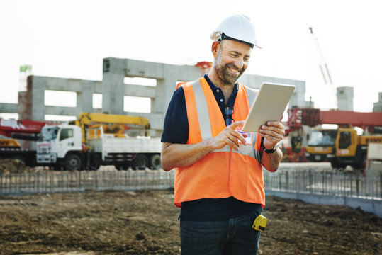 Construction Site Engineerer Working Blueprint