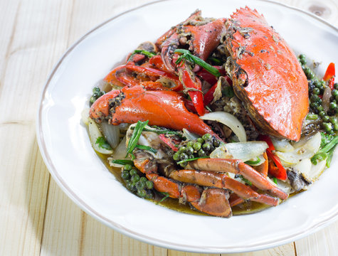 Stir fried crab with black pepper on white dish