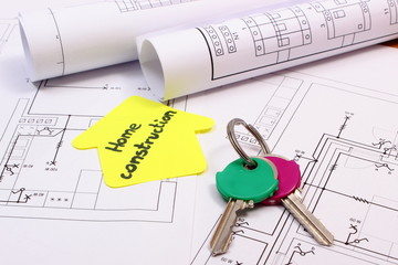 Home keys, house of yellow paper with text home construction and diagrams